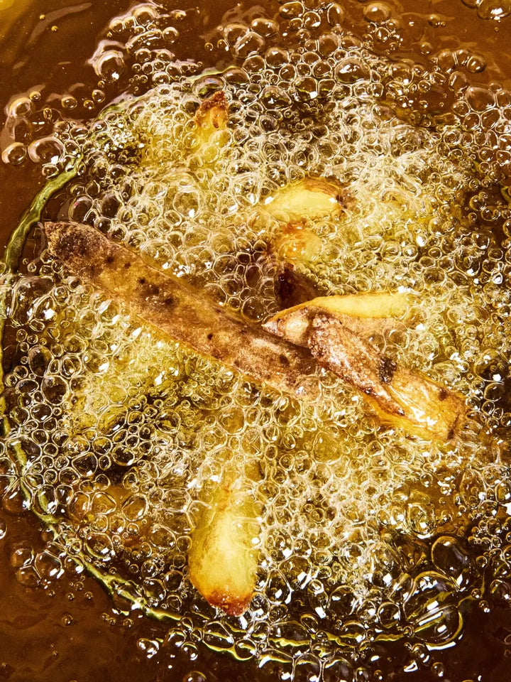 Deep fried french fries in bubbling Graza 'Frizzle' oil | Twentyseven Toronto