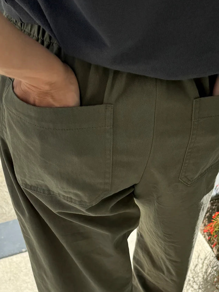 Close-up of the Gardener’s Pants in Army Green showing the elastic waistband and functional back patch pockets | Twentyseven Toronto
