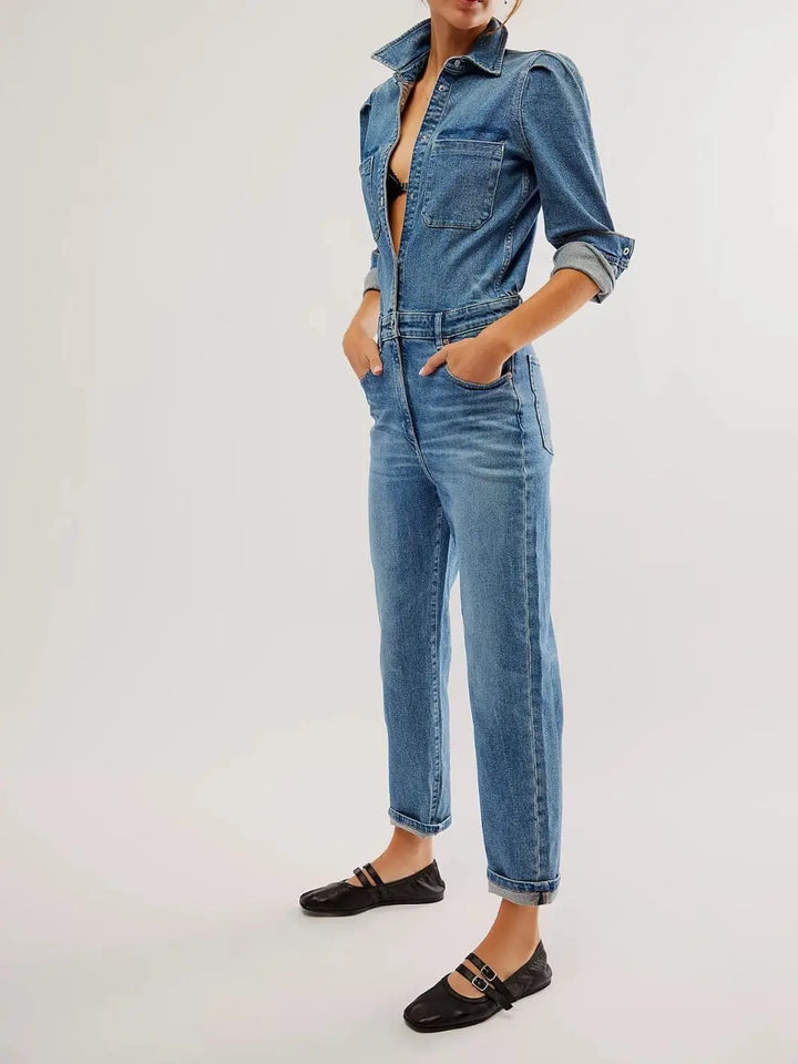 A full-length shot shows a model standing with hands in her pockets, wearing a blue denim jumpsuit styled with Free People Gemini Ballet Flats - Black | Twentyseven Toronto