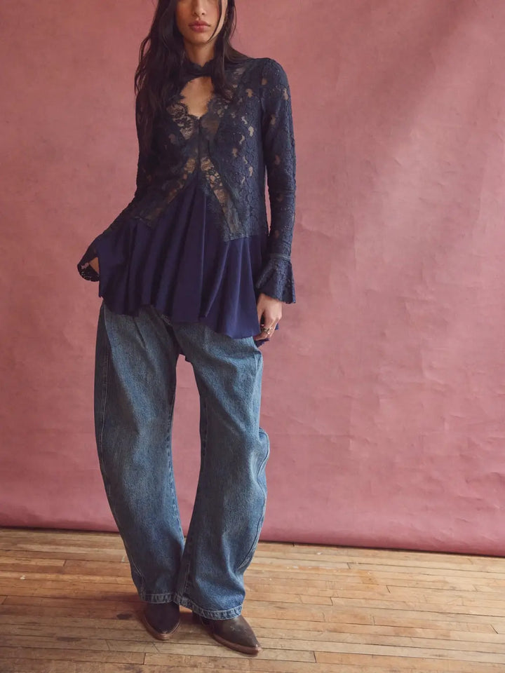Full-length view of a model wearing the relaxed Free People We the Free Golden Hour Trouser Jeans in Deacon Blue with western boots | Twentyseven
