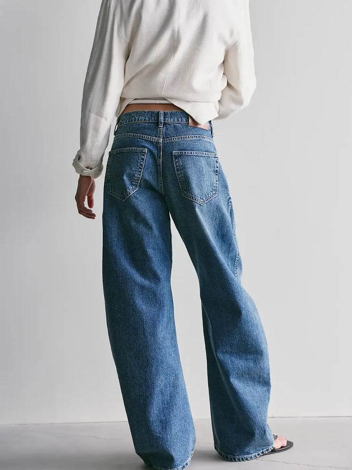 Back view showing the loose leg silhouette and back pockets of the Free People We the Free Golden Hour Trouser Jeans in Deacon Blue | Twentyseven
