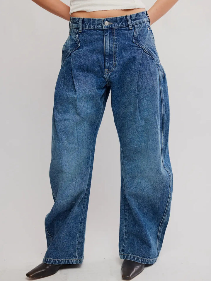 Front view of a model wearing wide-leg Free People We the Free Golden Hour Trouser Jeans in Deacon Blue paired with black boots | Twentyseven
