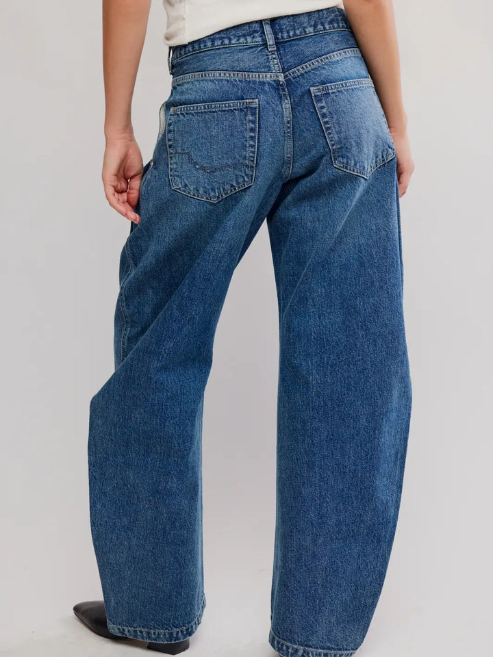 Back view of the mid-rise Free People We the Free Golden Hour Trouser Jeans in Deacon Blue showing the back pockets and relaxed fit | Twentyseven
