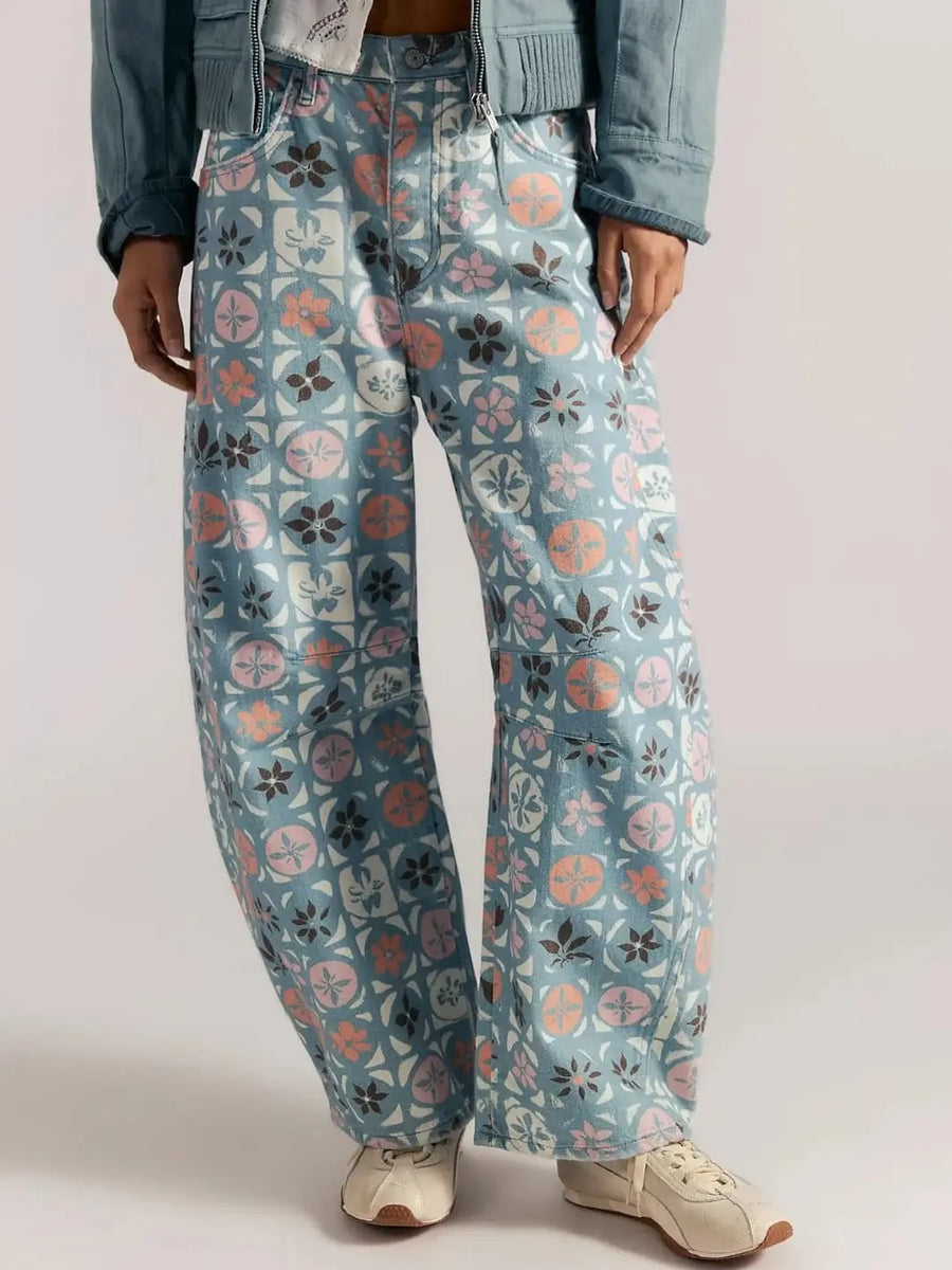 A front mid-section view showcases the relaxed, wide-leg fit and distinct graphic patchwork pattern of the Free People Good Luck Printed Barrel Jeans in Jade Combo Ditsy Block | Twentyseven Toronto