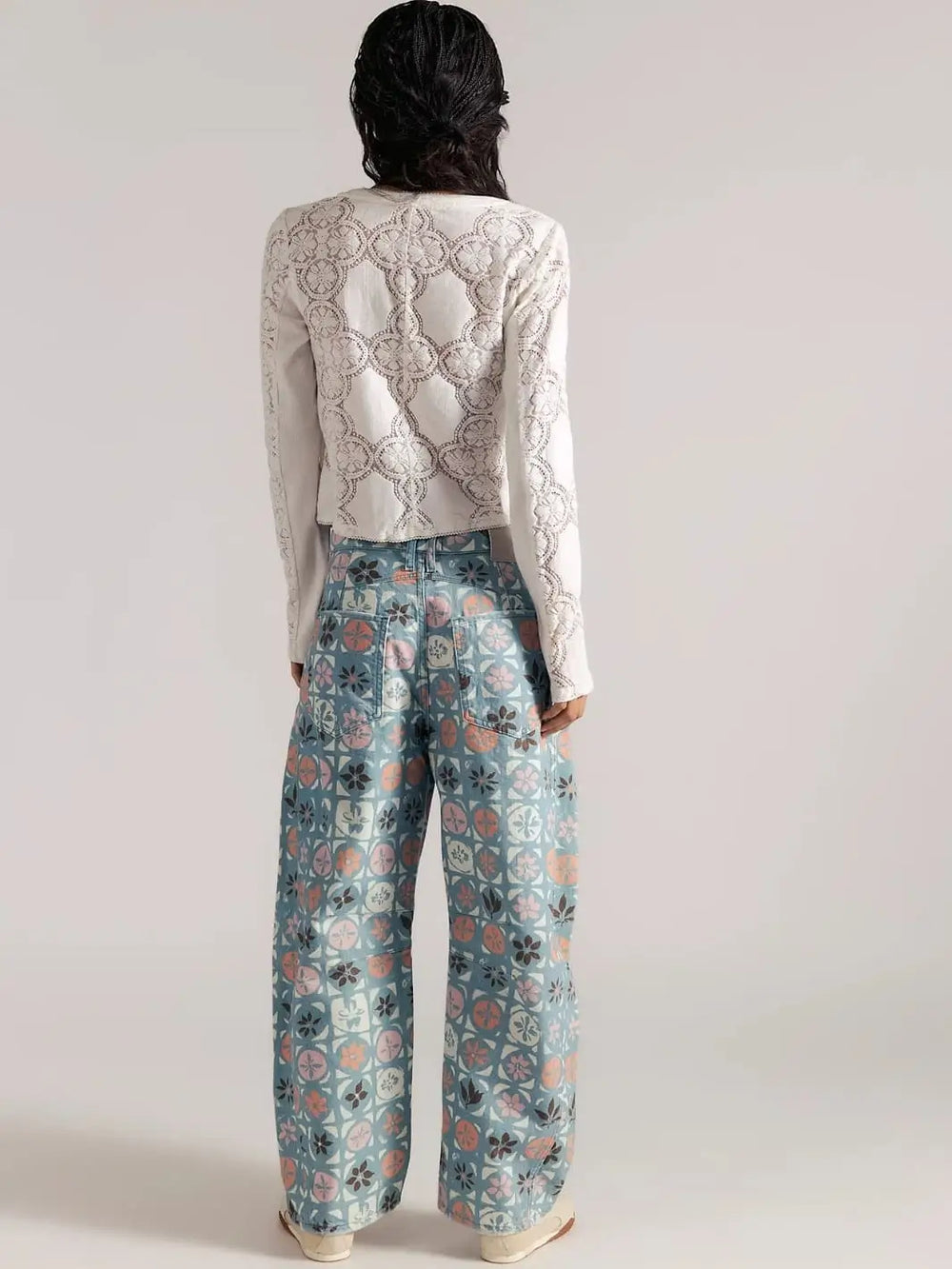 A direct rear view focuses on the stitched pocket placement and loose drape of the Free People Good Luck Printed Barrel Jeans in Jade Combo Ditsy Block | Twentyseven Toronto
