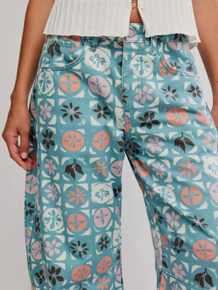 A close-up studio view highlights the front zipper fly, standard coin pocket, and intricate floral tile patterns of the Free People Good Luck Printed Barrel Jeans in Jade Combo Ditsy Block | Twentyseven Toronto