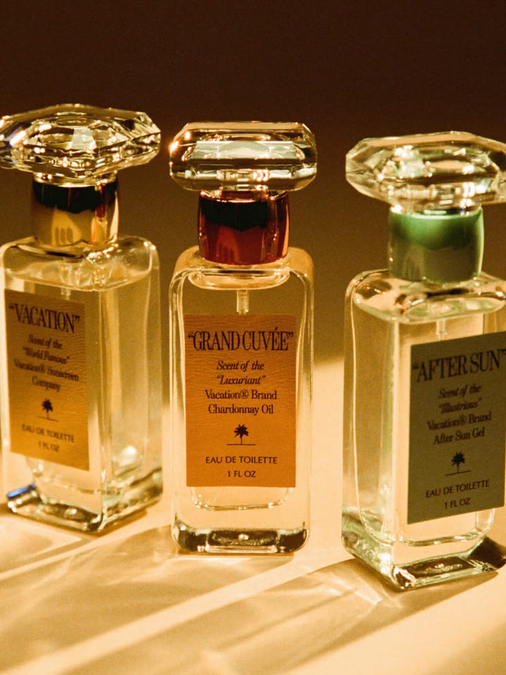 "GRAND CUVÉE" by Vacation Inc Eau de Toilette | Twentyseven Toronto | Three perfume bottles labeled 'Vacation', 'Grand Cuvée' and 'After Sun'