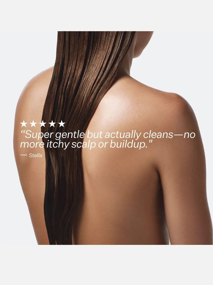 Person with long brown hair on a white background, with a 5 star testimonial quote about Act+Acre Cold Processed Hair Cleanse | Twentyseven Toronto