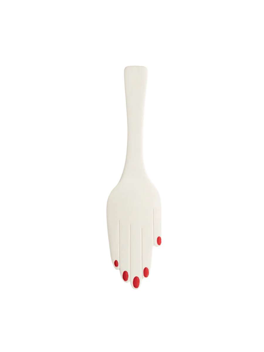 White ceramic hand cake server with red nail polish from Maison Balzac on a transparent background | Twentyseven Toronto