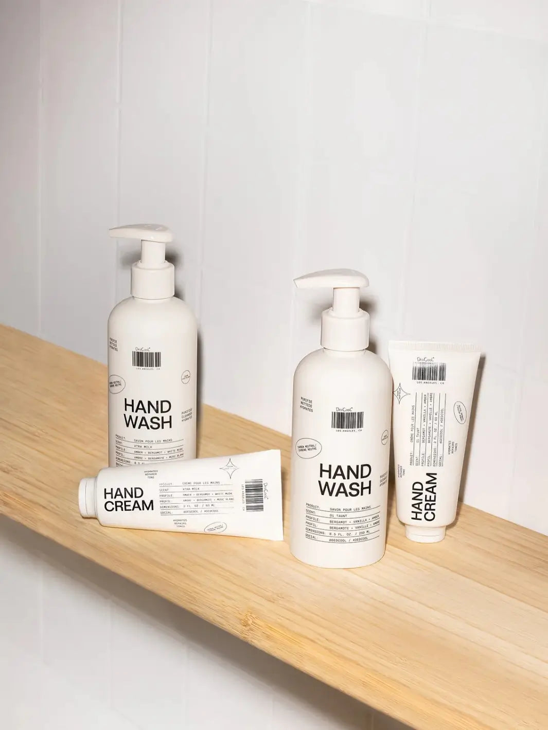A selection of Dedcool body care products including the hand washes and hand creams arranged on a wooden shelf | Twentyseven