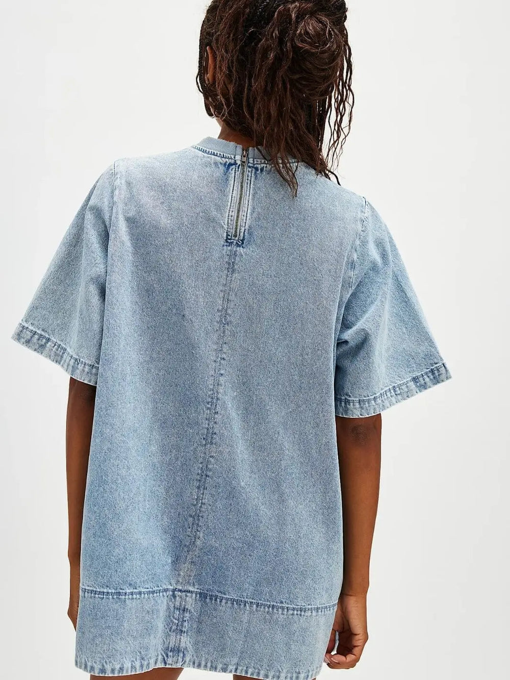 A view from the back emphasizes the exposed silver zipper closure and clean paneled stitching of the Free People Harlow Mini Dress - Ocean Blue | Twentyseven Toronto