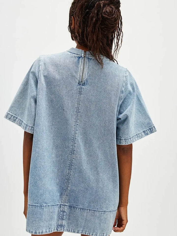 A view from the back emphasizes the exposed silver zipper closure and clean paneled stitching of the Free People Harlow Mini Dress - Ocean Blue | Twentyseven Toronto