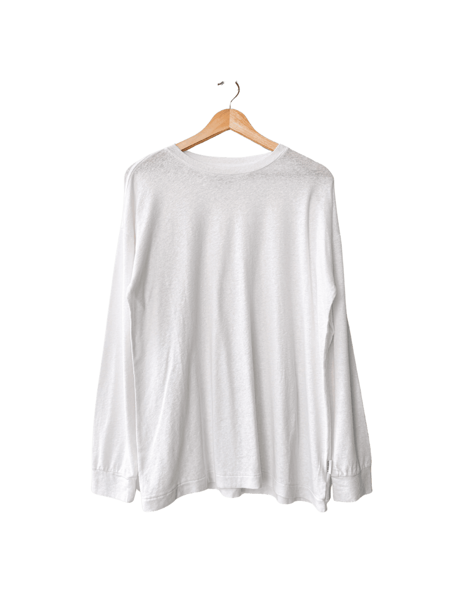 White long-sleeve 'Haze Linen Blend Tee' shirt from Le Bon Shoppe on a hanger against a transparent background | Twentyseven Toronto