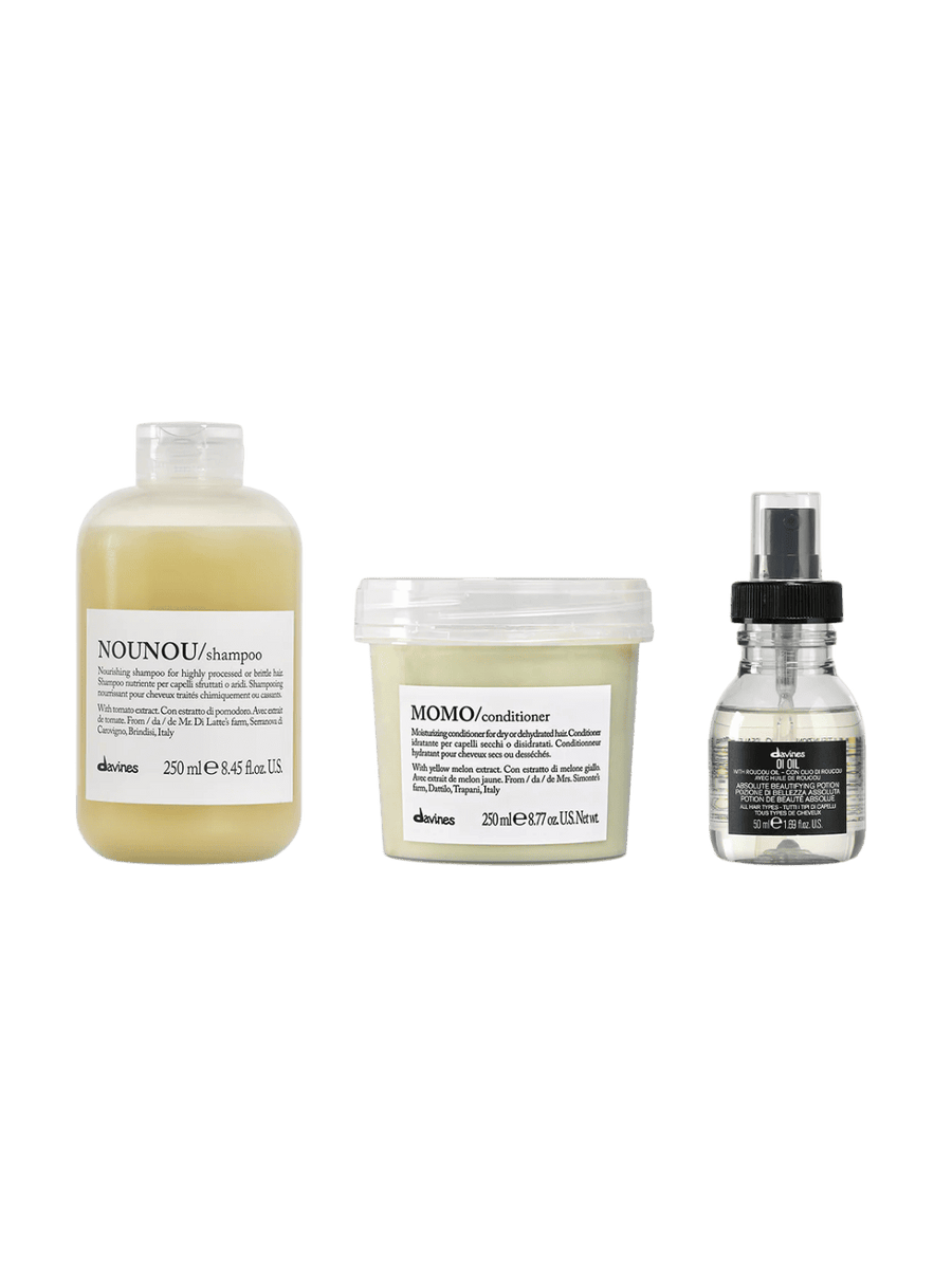 Set of three hair care products from Davines including NOUNOU Shampoo (250ml), MOMO Conditioner (250ml) and OI Oil (50ml) on a transparent background | Twentyseven Toronto