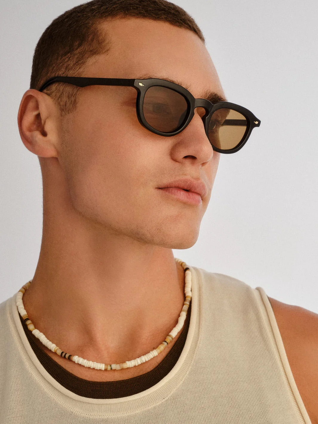 Model wearing Le Specs Heart Throb sunglasses in black with light brown lenses | Twentyseven Toronto