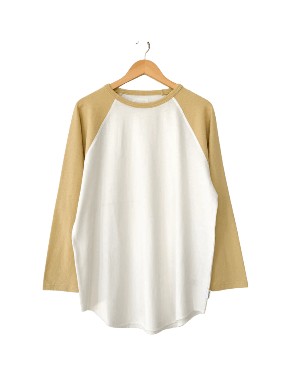 The two-toned white and yellow Le Bon Shoppe Heavy Cotton Raglan Tee in White/Butter hangs straight from a wooden hanger | Twentyseven Toronto