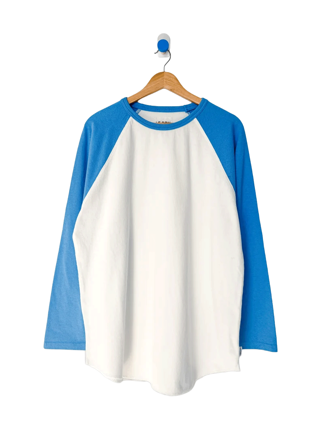Le Bon Shoppe Heavy Cotton Raglan in white with blue sleeves on a wooden hanger | Twentyseven Toronto