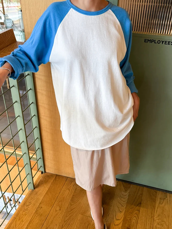 Model wearing the white and blue Le Bon Shoppe Heavy Cotton Raglan with a relaxed oversized silhouette | Twentyseven Toronto