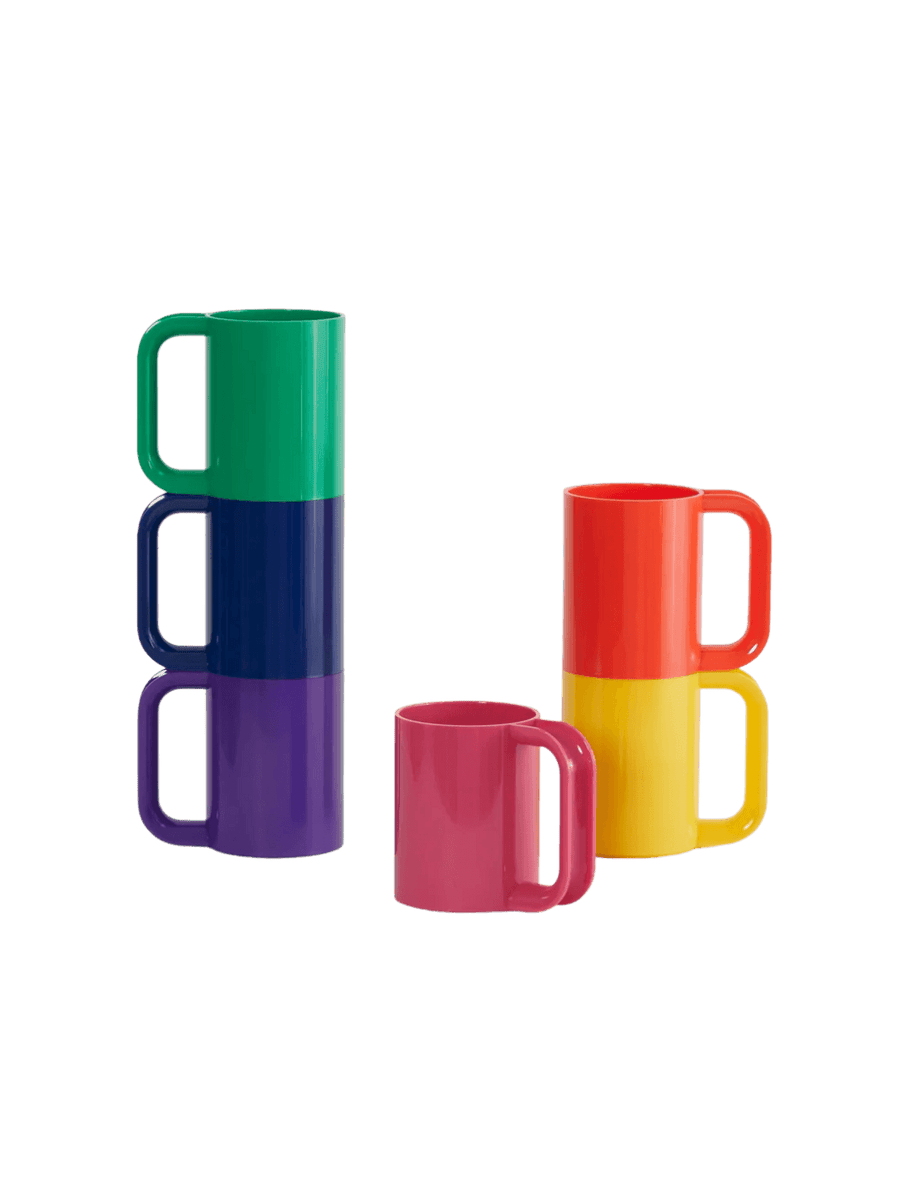 A set of colourful mugs separated into a stack of three cool-toned mugs, a stack of two warm-toned mugs, and a single pink mug sitting in front from the The Heller Max Dinnerware Maxmug in Rainbow - Set of 6 | Twentyseven Toronto