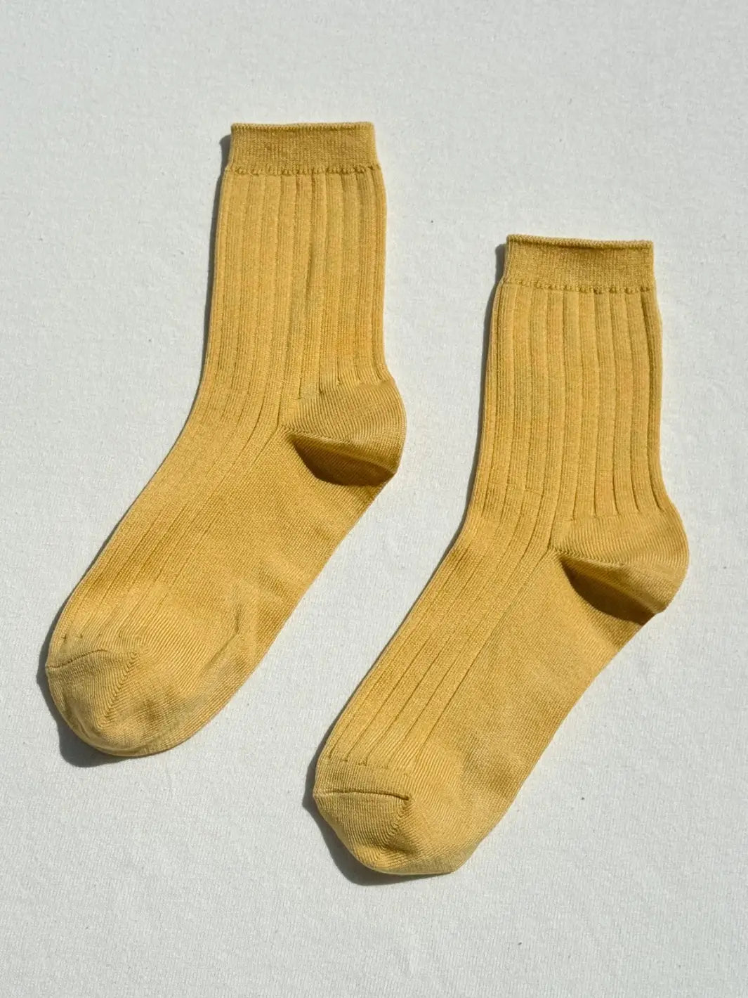 Pair of mustard yellow Le Bon Shoppe Her Socks in Buttercup on a white background | Twentyseven Toronto