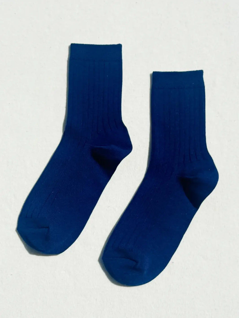 Pair of navy blue Le Bon Shoppe Her Socks in 'Midnight' on a white background | Twentyseven Toronto