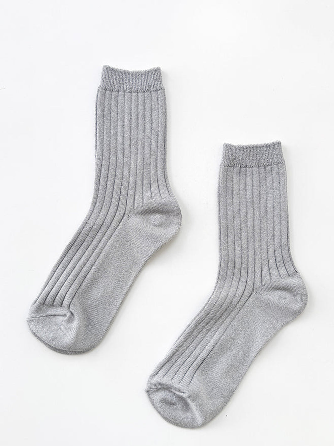 Pair of Le Bon Shoppe Her Socks Lurex in Silver featuring a ribbed texture and subtle metallic shimmer | Twentyseven Toronto