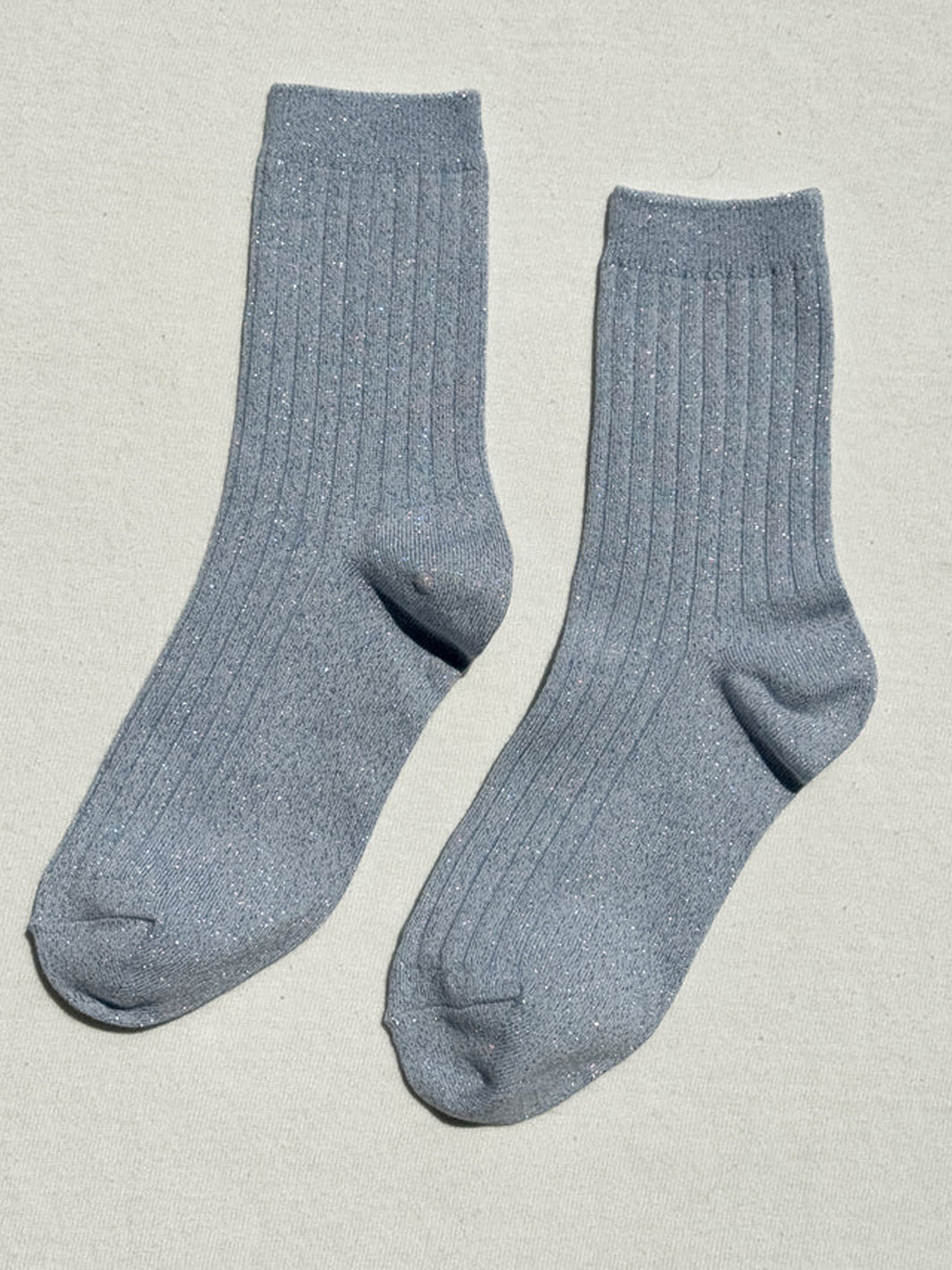 Pair of Le Bon Shoppe Her Socks Lurex in Morning Mist featuring a ribbed texture and metallic shimmer | Twentyseven Toronto