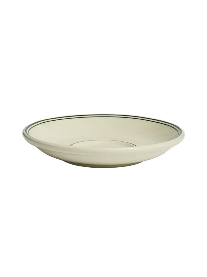 Low-angle side view of an off-white HL Greenband - Saucer (6") from Fishs Eddy with green circle lines | Twentyseven Toronto
