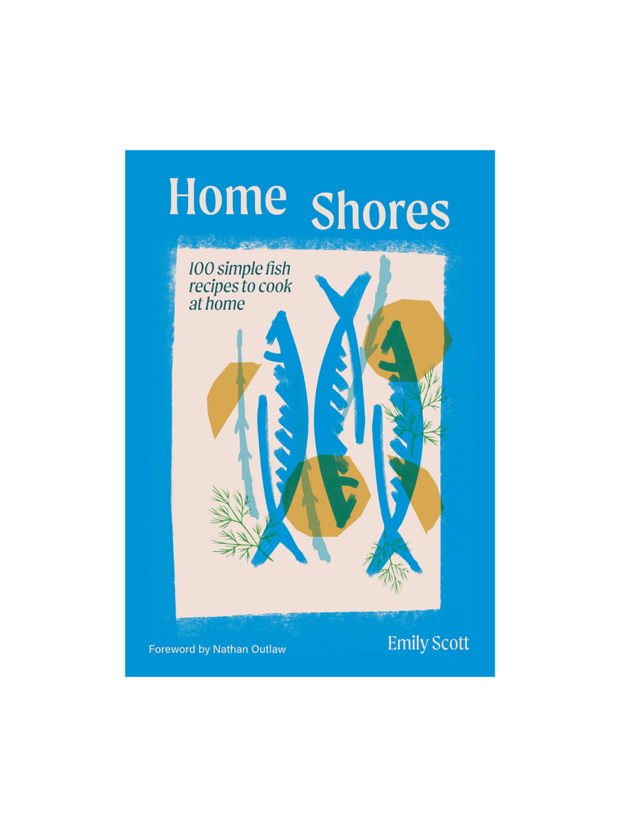 This is the front cover of the cookbook Home Shores: 100 Simple Fish Recipes to Cook at Home by Emily Scott, featuring a bright blue border and a central illustration of three blue fish, yellow lemon shapes, and green dill sprigs | Twentyseven Toronto