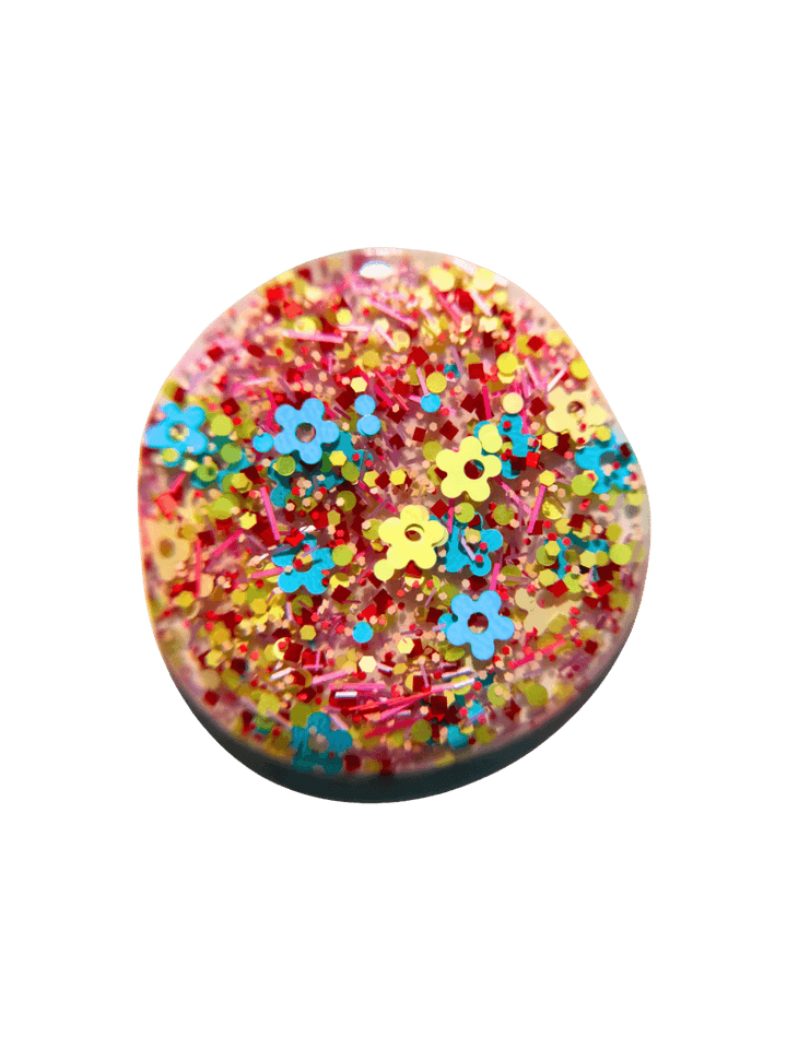 Product swatch of pastel, fun shaped glitter 'Hot Pants Nail Polish' by Death Valley Nails on a transparent background | Twentyseven Toronto