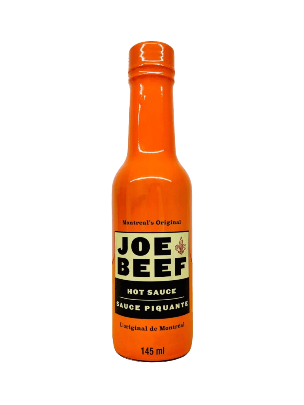 A 145 mL glass bottle filled with a bright orange Hot Sauce Joe Beef condiment features a cream and black label reading "Montreal's Original Joe Beef Hot Sauce Sauce Piquante" | Twentyseven Toronto