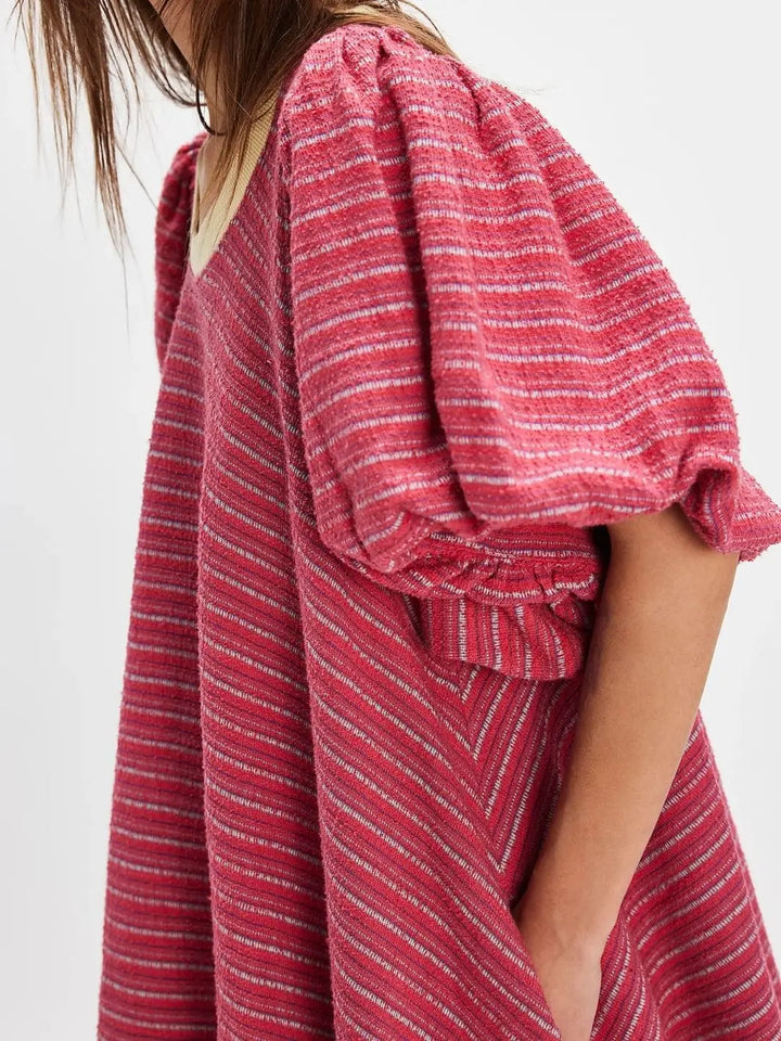 A side-angle view highlights the voluminous puff sleeves, textured striped pattern, and relaxed silhouette of the Free People Hudson Pullover - Red Combo | Twentyseven Toronto