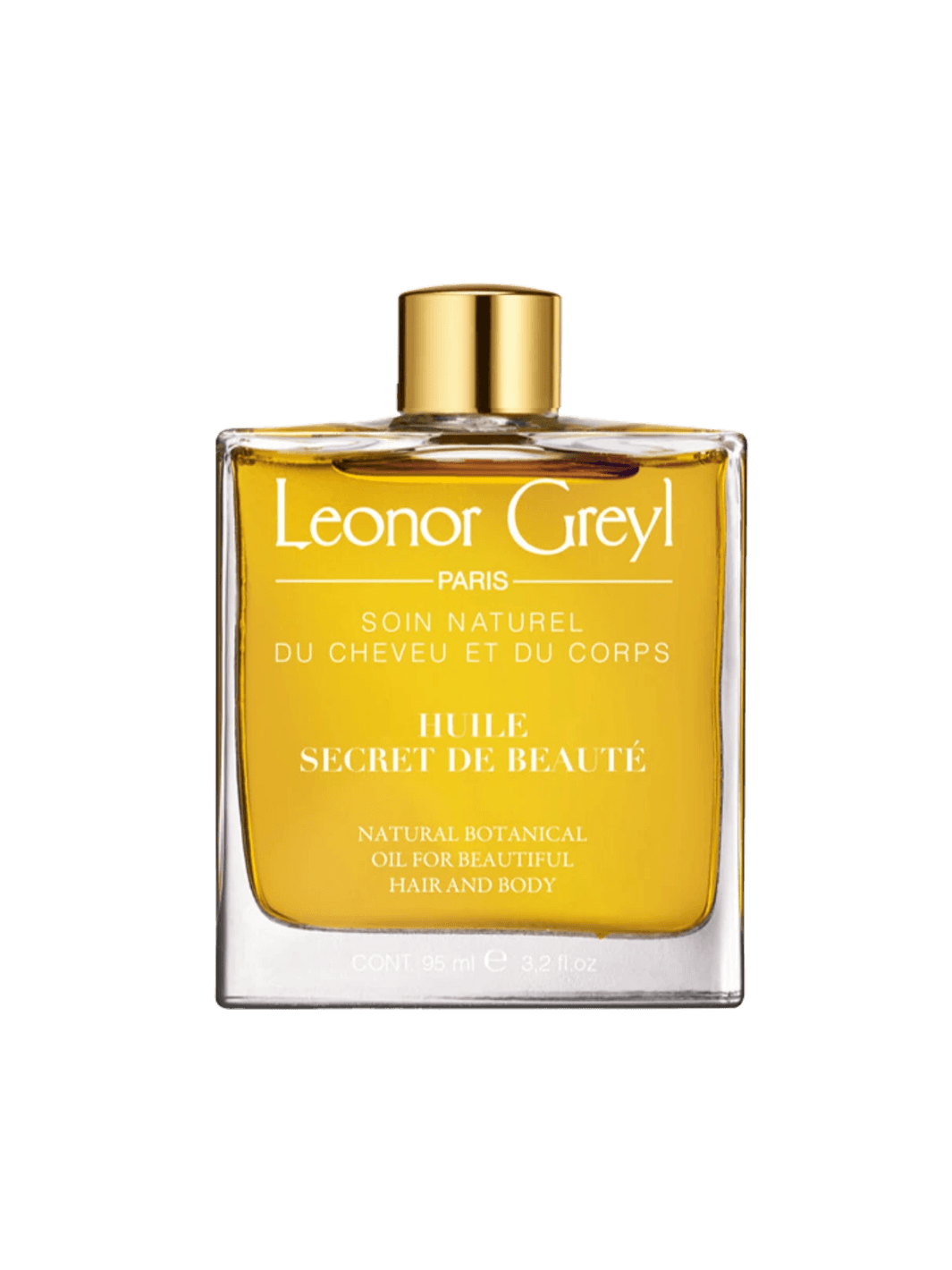 Glass bottle of gold liquid 'Huile Secret de Beauté' by Leonor Greyl on a transparent background | Twentyseven Toronto
