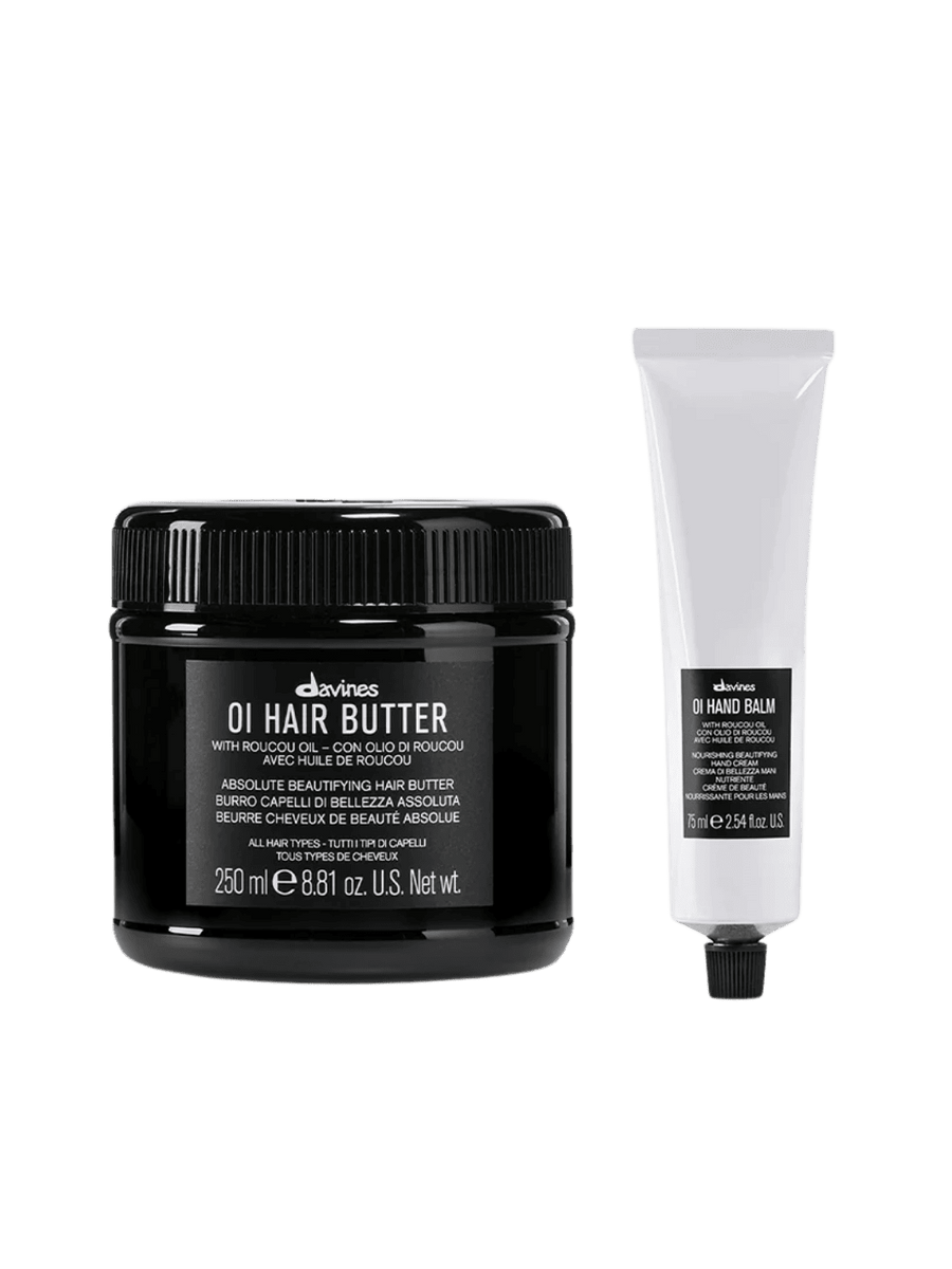Black jar of Davines OI Hair Butter (250ml) and white tube of Davines OI Hand Balm (75ml) on a transparent background | Twentyseven Toronto