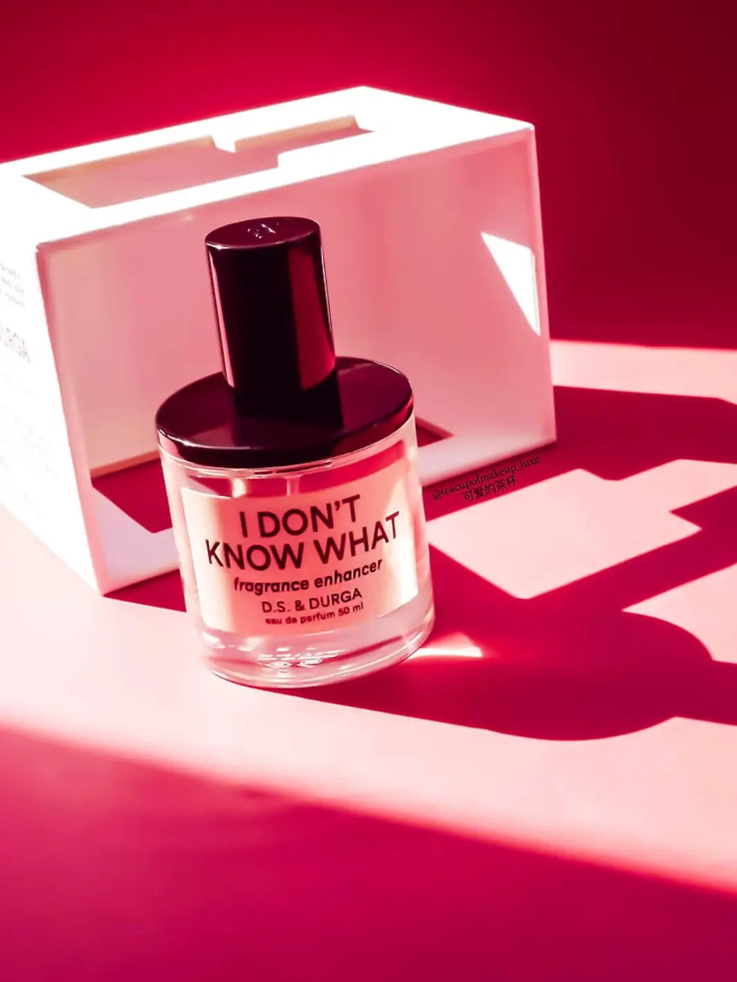 Perfume bottle labeled 'I Don't Know What' by D.S. & Durga on a red background | Twentyseven Toronto