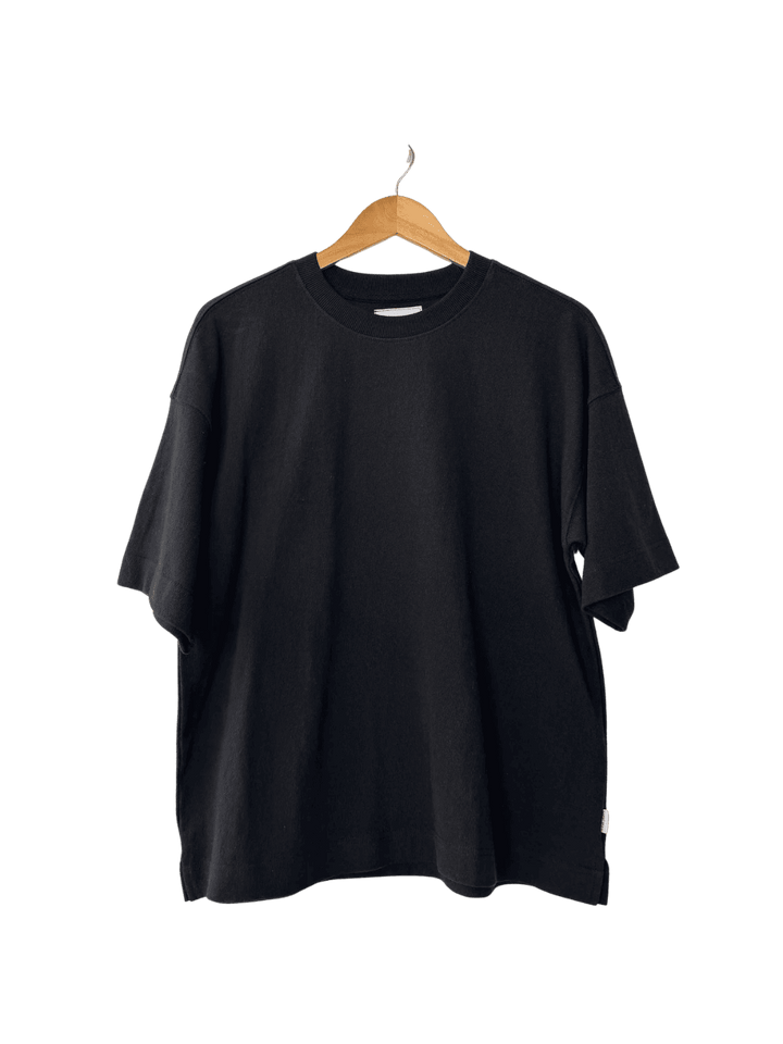 Black 'Jayden Tee' t-shirt from Le Bon Shoppe on a wooden hanger | Twentyseven Toronto