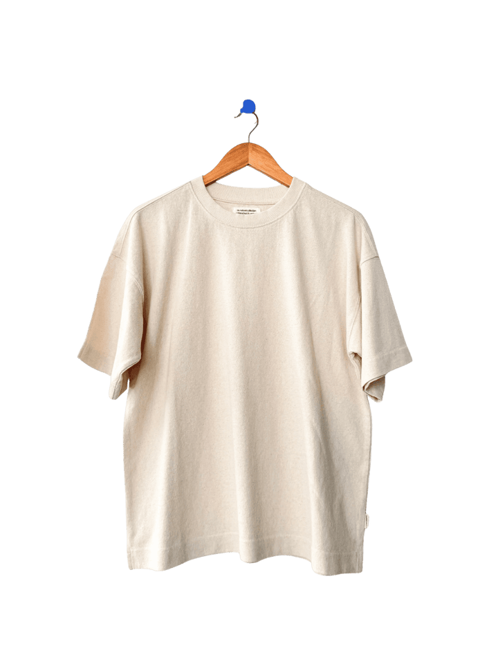 Cream 'Jayden Tee' t-shirt in 'Naturel' from Le Bon Shoppe on a wooden hanger | Twentyseven Toronto