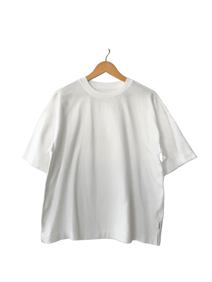 White 'Jayden Tee' t-shirt from Le Bon Shoppe on a wooden hanger | Twentyseven Toronto