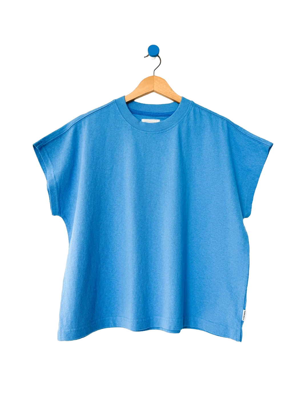 Le Bon Shoppe Jeanne Tee in French Blue on a wooden hanger | Twentyseven Toronto