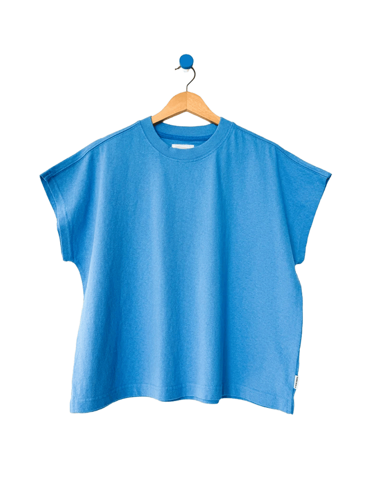 Le Bon Shoppe Jeanne Tee in French Blue on a wooden hanger | Twentyseven Toronto