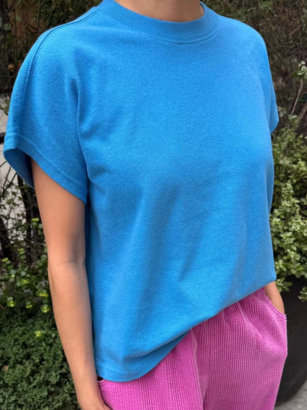 Model wearing the Le Bon Shoppe Jeanne Tee in French Blue with pink corduroy pants | Twentyseven Toronto