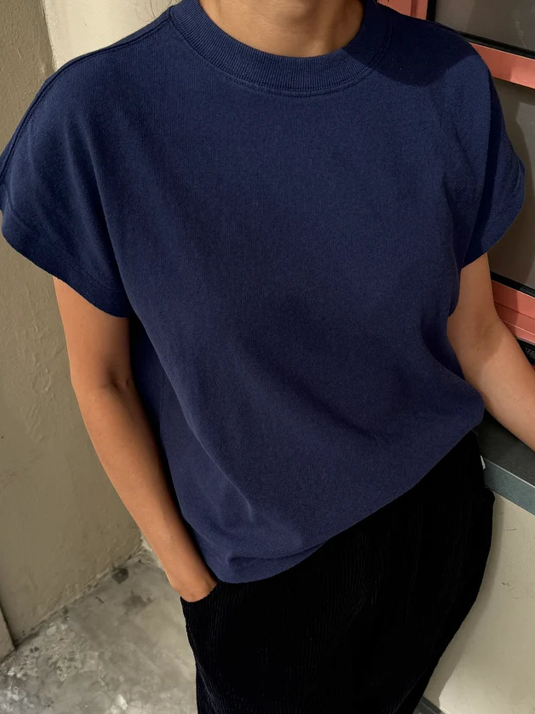 Model wearing the Le Bon Shoppe Jeanne Tee in Midnight styled with black pants | Twentyseven Toronto