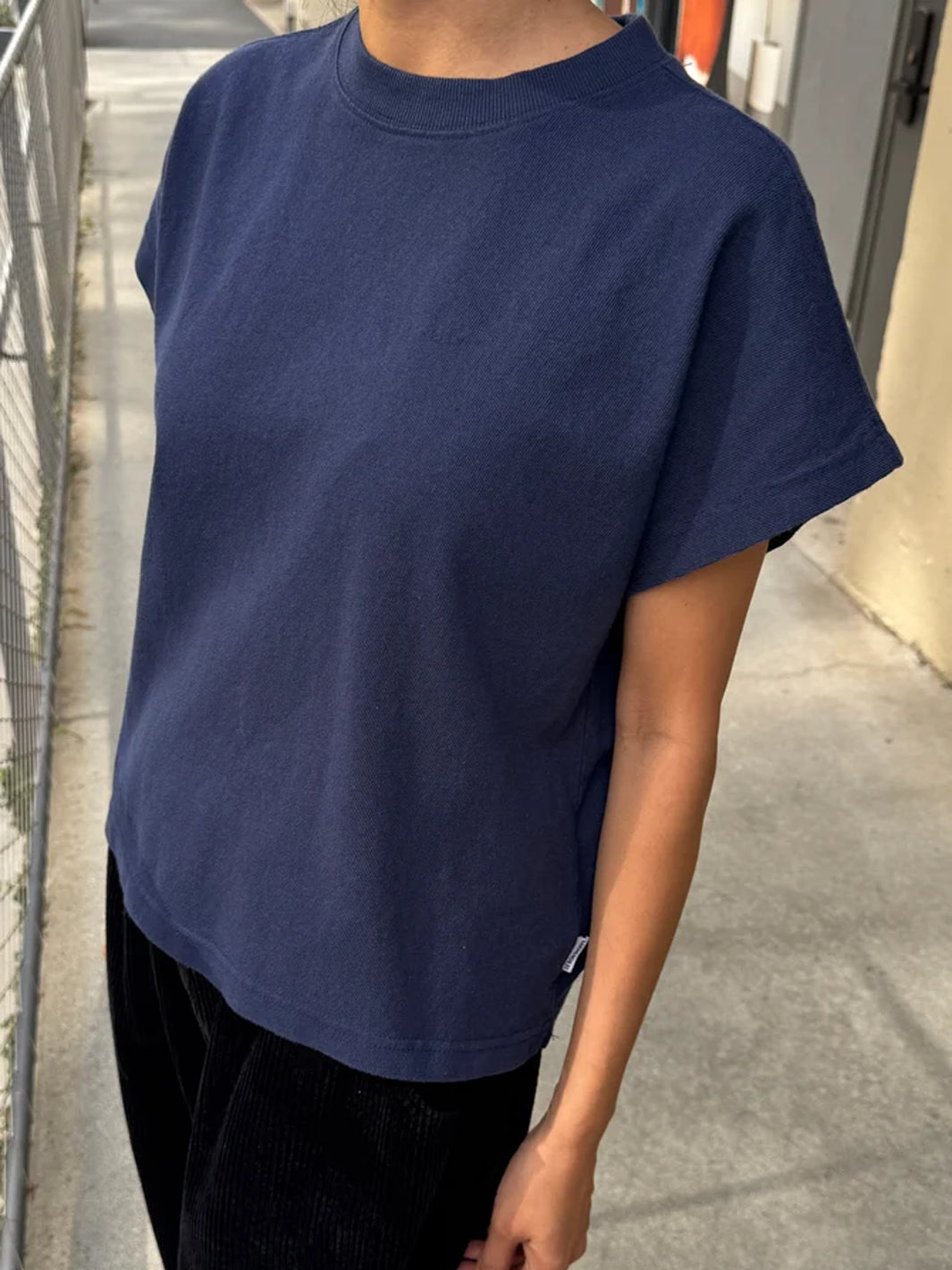 Model wearing the Le Bon Shoppe Jeanne Tee in Midnight with black pants | Twentyseven Toronto