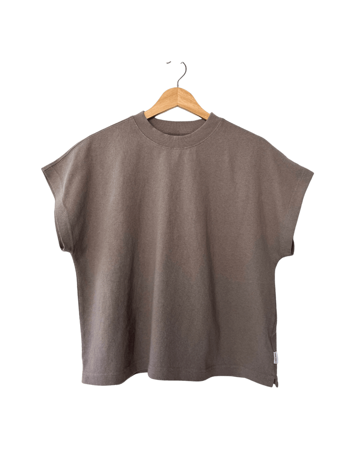 Brown sleeveless 'Jeanne Tee' top in 'Mushroom' from Le Bon Shoppe on a hanger against a transparent background | Twentyseven Toronto