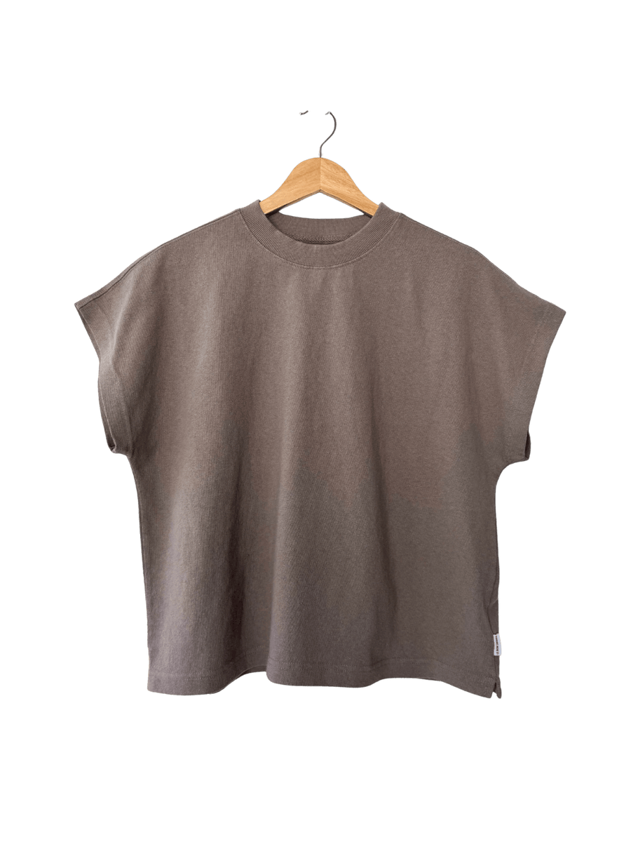 Brown sleeveless 'Jeanne Tee' top in 'Mushroom' from Le Bon Shoppe on a hanger against a transparent background | Twentyseven Toronto