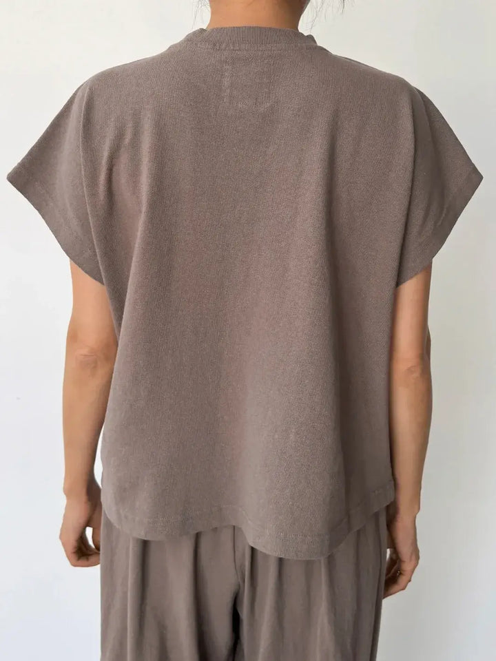 Person wearing a brown sleeveless top, 'Jeanne Tee' in 'Mushroom' from Le Bon Shoppe and matching pants on a white background, back view | Twentyseven Toronto