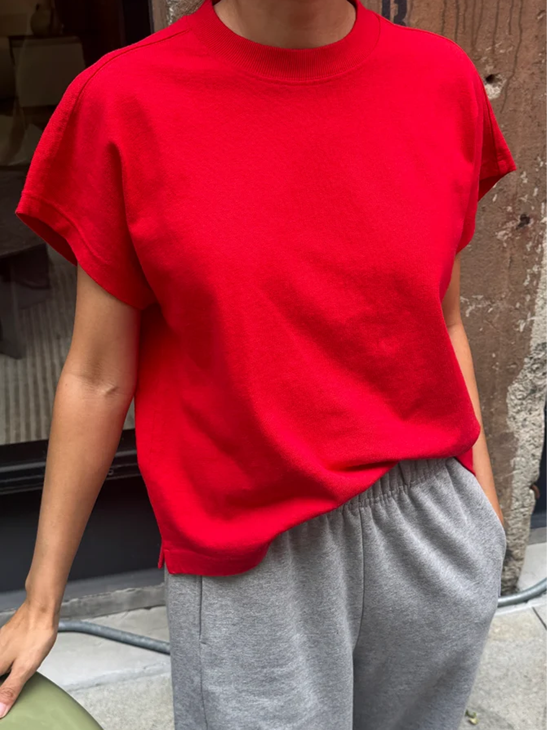 Model wearing the Le Bon Shoppe Jeanne Tee in Tomato with grey pants | Twentyseven Toronto