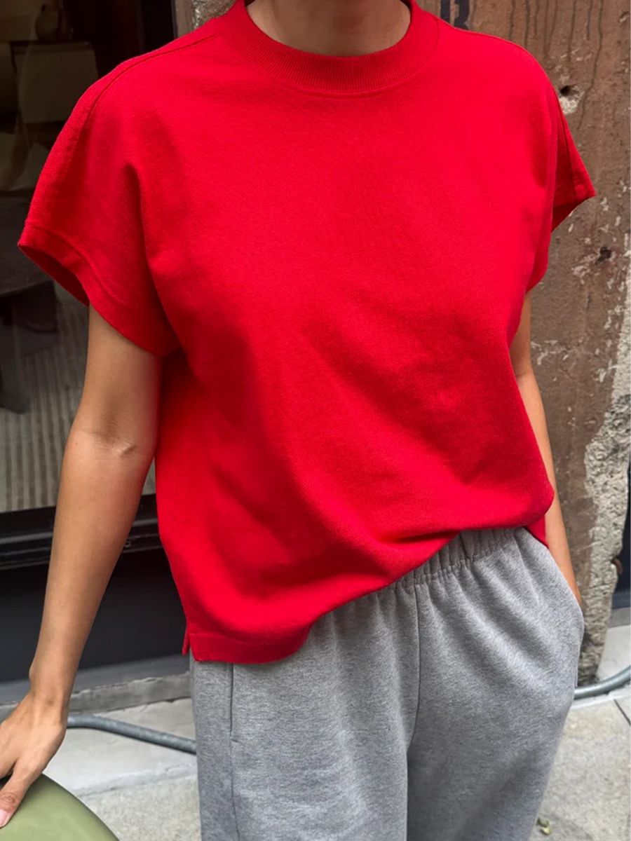 Model wearing the Le Bon Shoppe Jeanne Tee in Tomato with grey pants | Twentyseven Toronto
