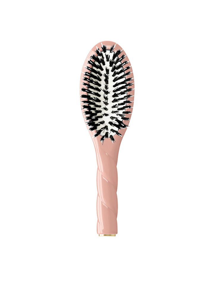 Front view of La Bonne Brosse N.02 Small The Essential Detangling & Conditioning Brush in Lilac Pink featuring a twisted ergonomic handle and natural boar bristles | Twentyseven Toronto