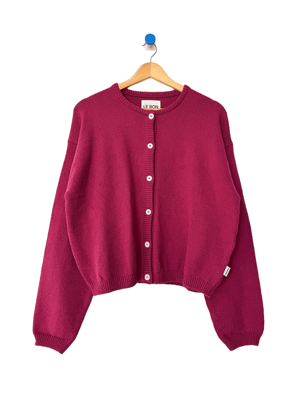 Le Bon Shoppe Laila Cardigan in Prune on a wooden hanger | Twentyseven Toronto